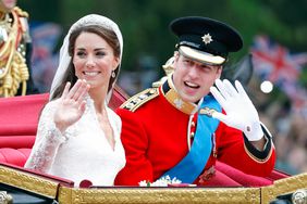 Princess Kate and Prince William waving from a carriage