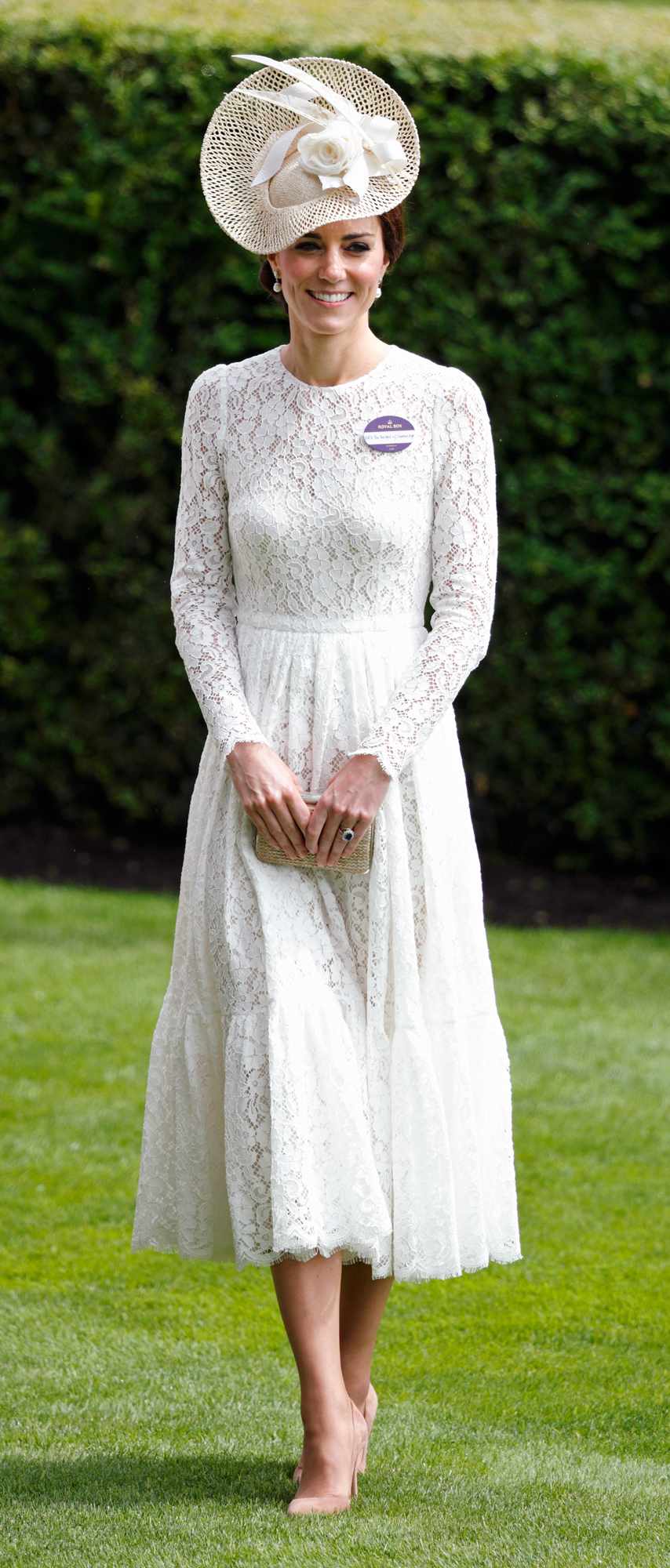 Kate Middleton in a cream long-sleeve lace Dolce and Gabbana midi-length dress 