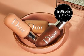 Dior foundations in a bowl on a beige surface