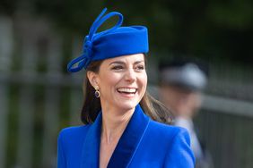Kate Middleton Blue Dress Coat and Fascinator Smiling Looking to the Side Easter Mattins Service 2023