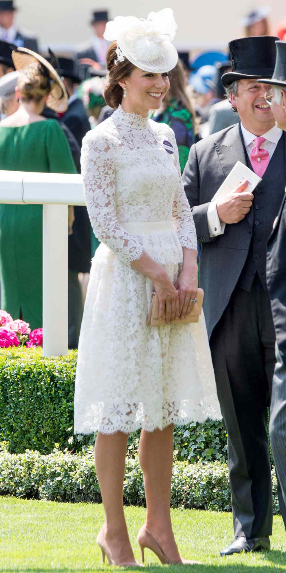 Kate Middleton in a white lace Alexander McQueen dress and hat