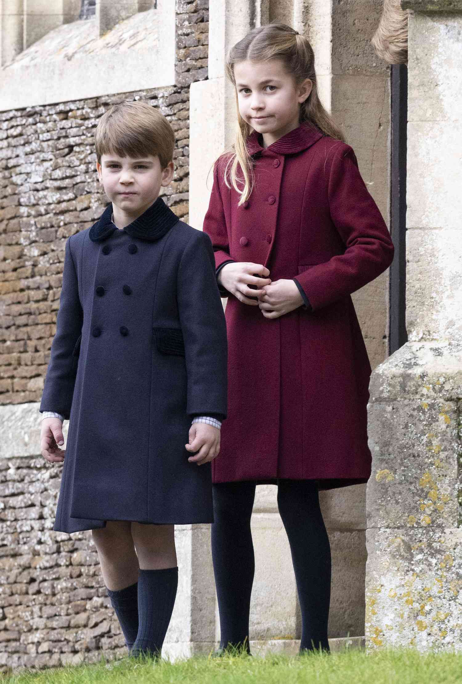 Prince Louis and Princess Charlotte standing