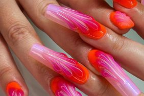 Pink and orange 3D nail art.