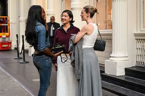 Three women talking on the street at new york fashion week