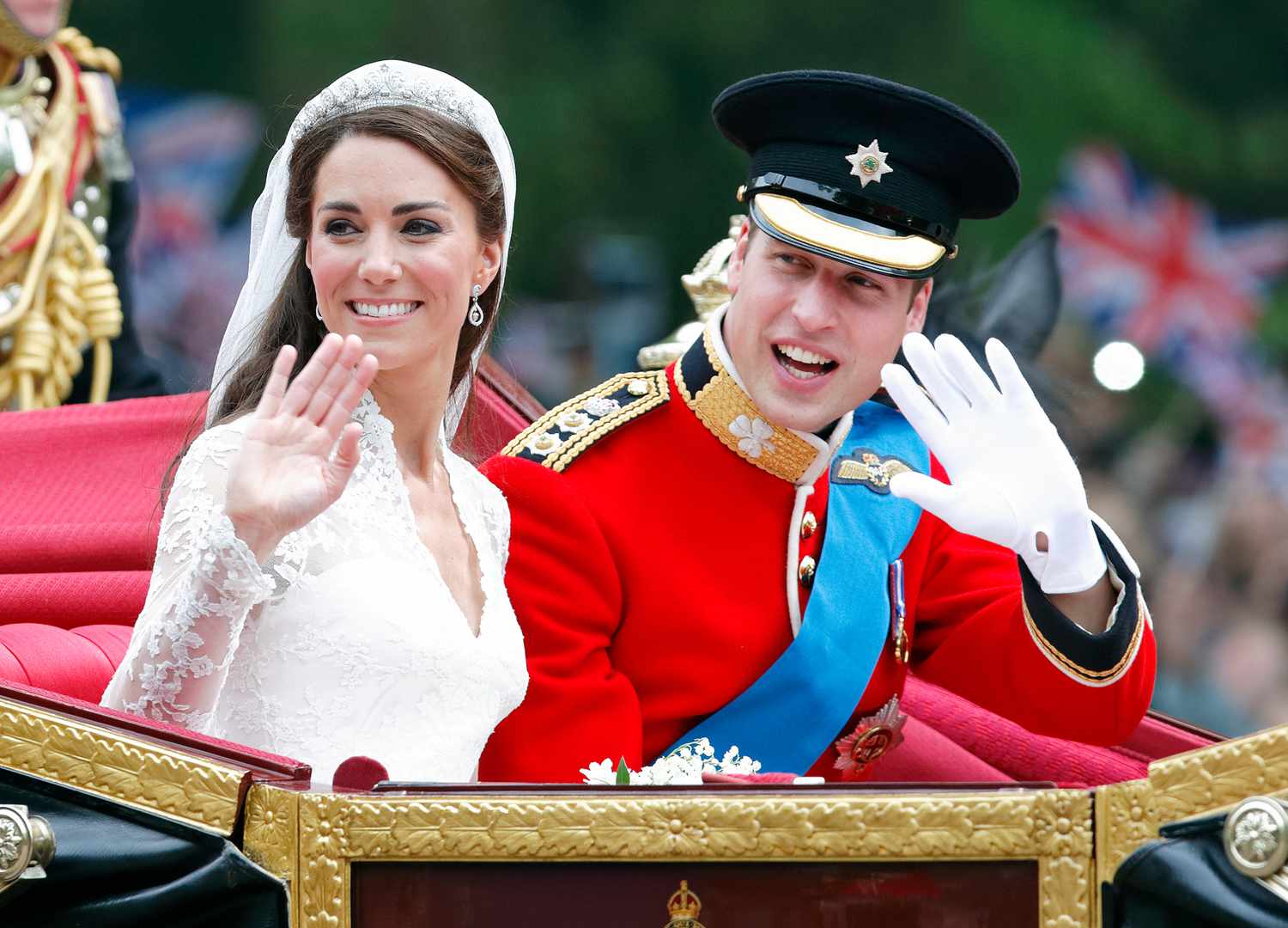 Princess Kate and Prince William waving from a carriage