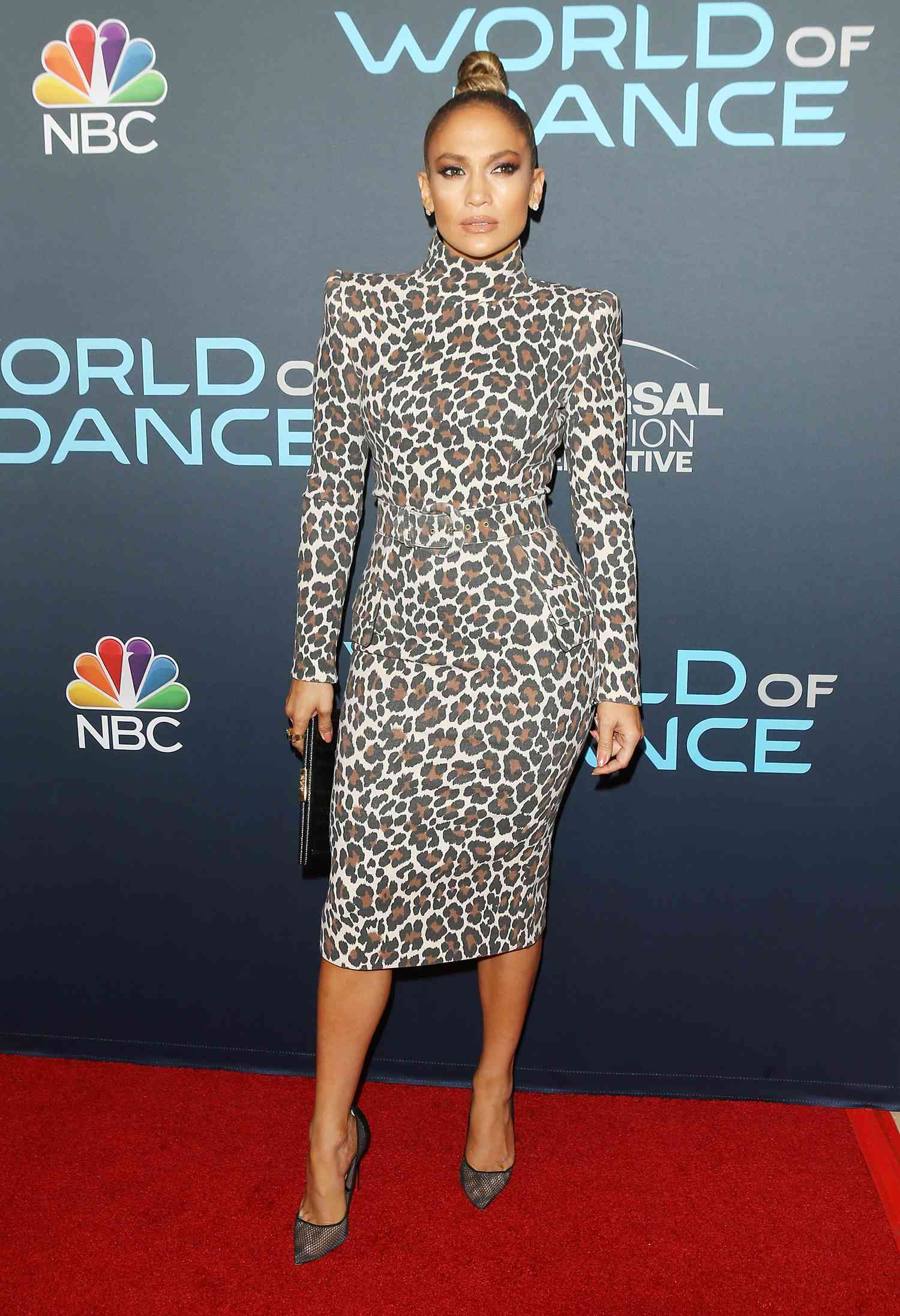 Jennifer Lopez photographed in a cheetah print body con dress