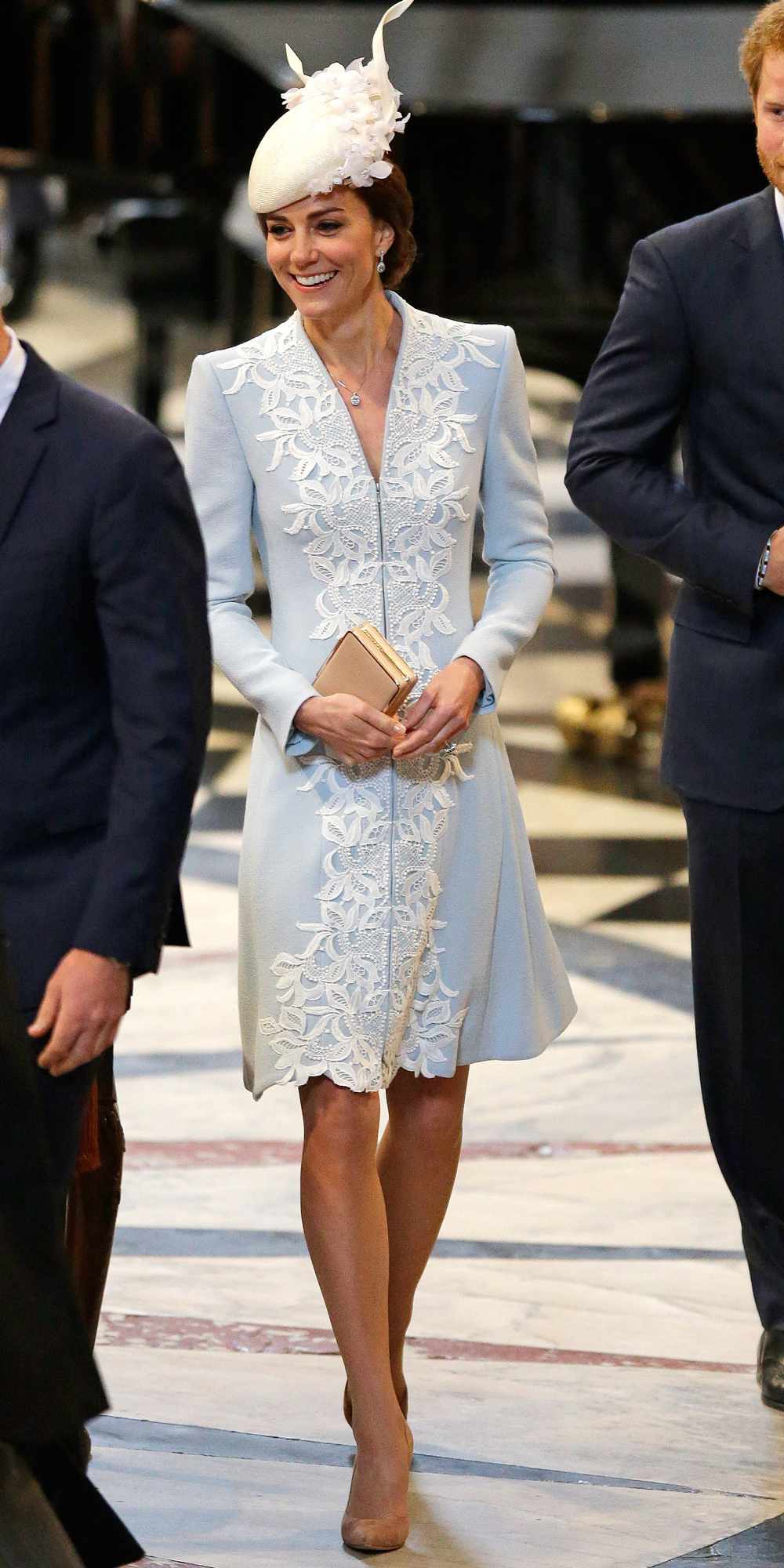Kate Middleton in a light blue and white embroidered coat dress