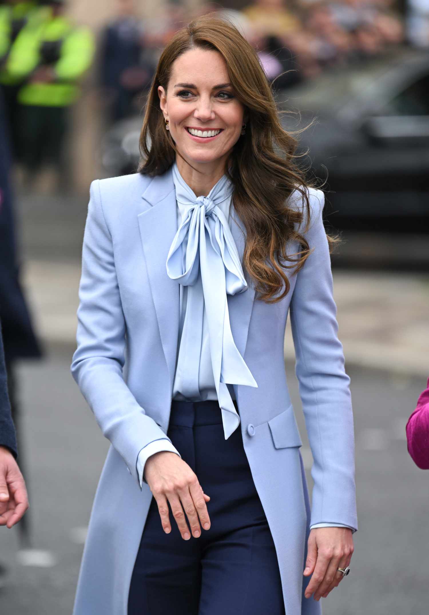 Kate Middleton in a dusty blue equestrian coat with tied silk blouse