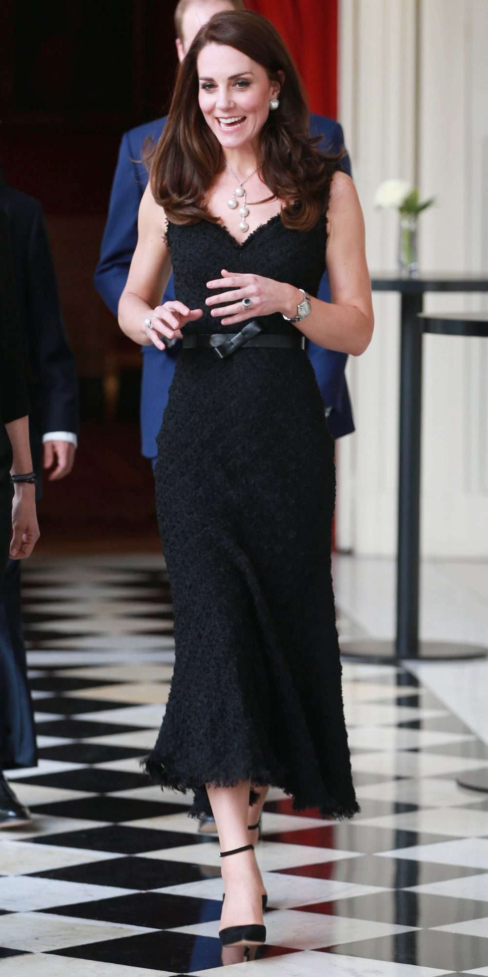 Kate Middleton in a textured, mermaid-cut black Alexander McQueen gown