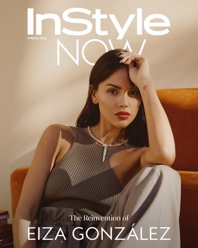 Eiza Gonzalez InStyle Now sitting on floor leaning on orange couch wearing a brown hermes set