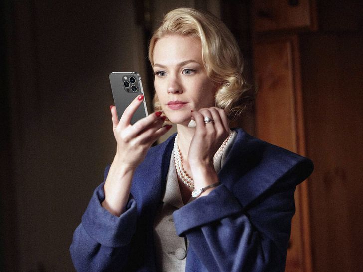 Betty Draper from Mad Men Checking Reflection in Smart Phone