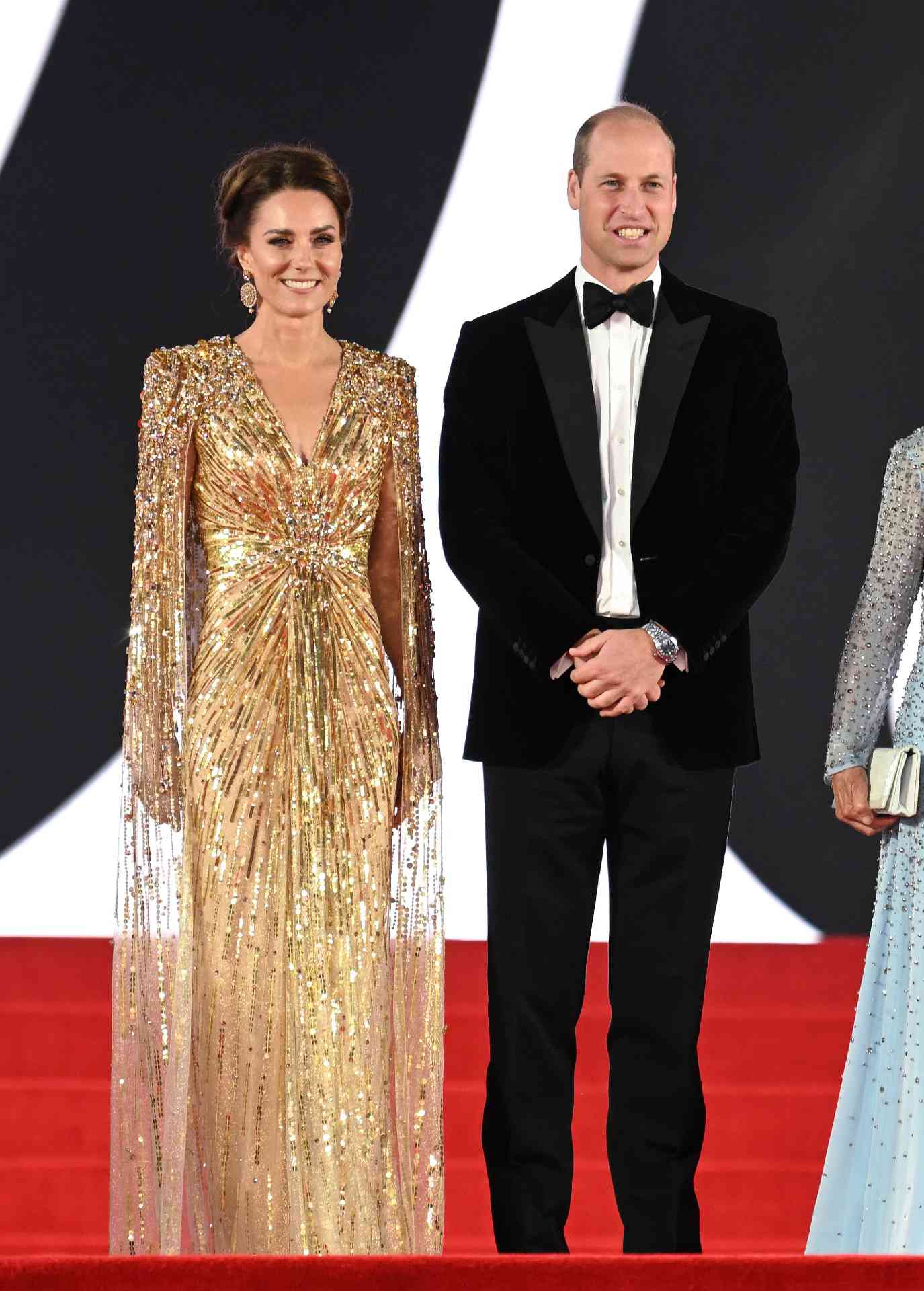 Kate Middleton in a stunning gold gown alongside Prince William