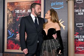 Jennifer Lopez in Black Gown Sheer Skirt and Ben Affleck Looking at Each Other at Red Carpet Premiere of 'This Is Me...Now'