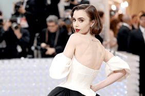 Lily Collins wears black and white dress