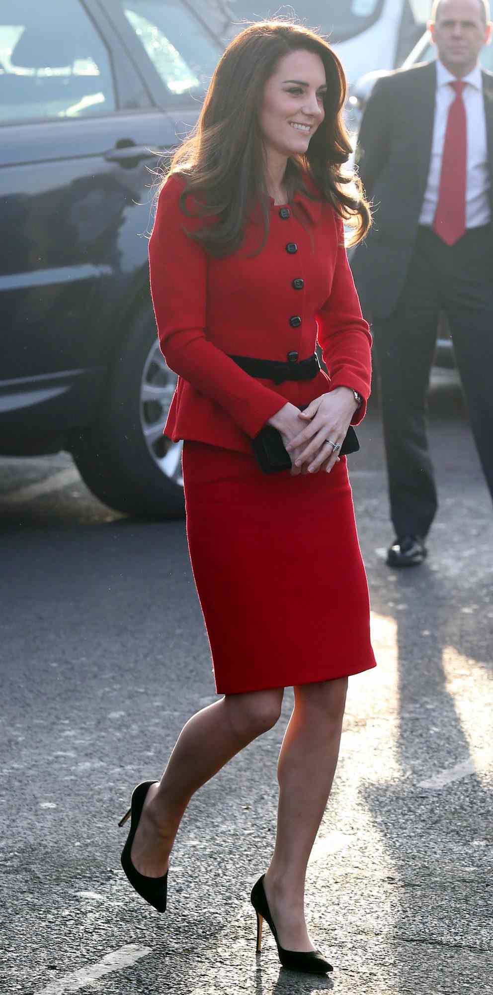 Kate Middleton in a red Luisa Spagnoli suit and heels