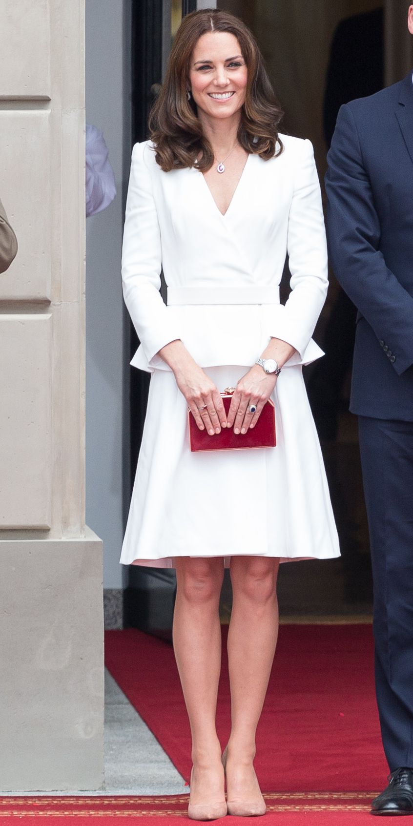 Kate Middleton in a white Alexander McQueen peplum ensemble and Gianvito Rossi suede nude heels 