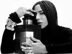 Olivier Rousteing with Balmain perfume bottle 