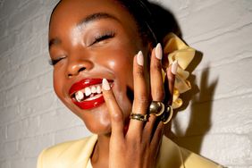 A model showing off a chrome French manicure at the Alice + Olivia Spring 2025 Presentation.