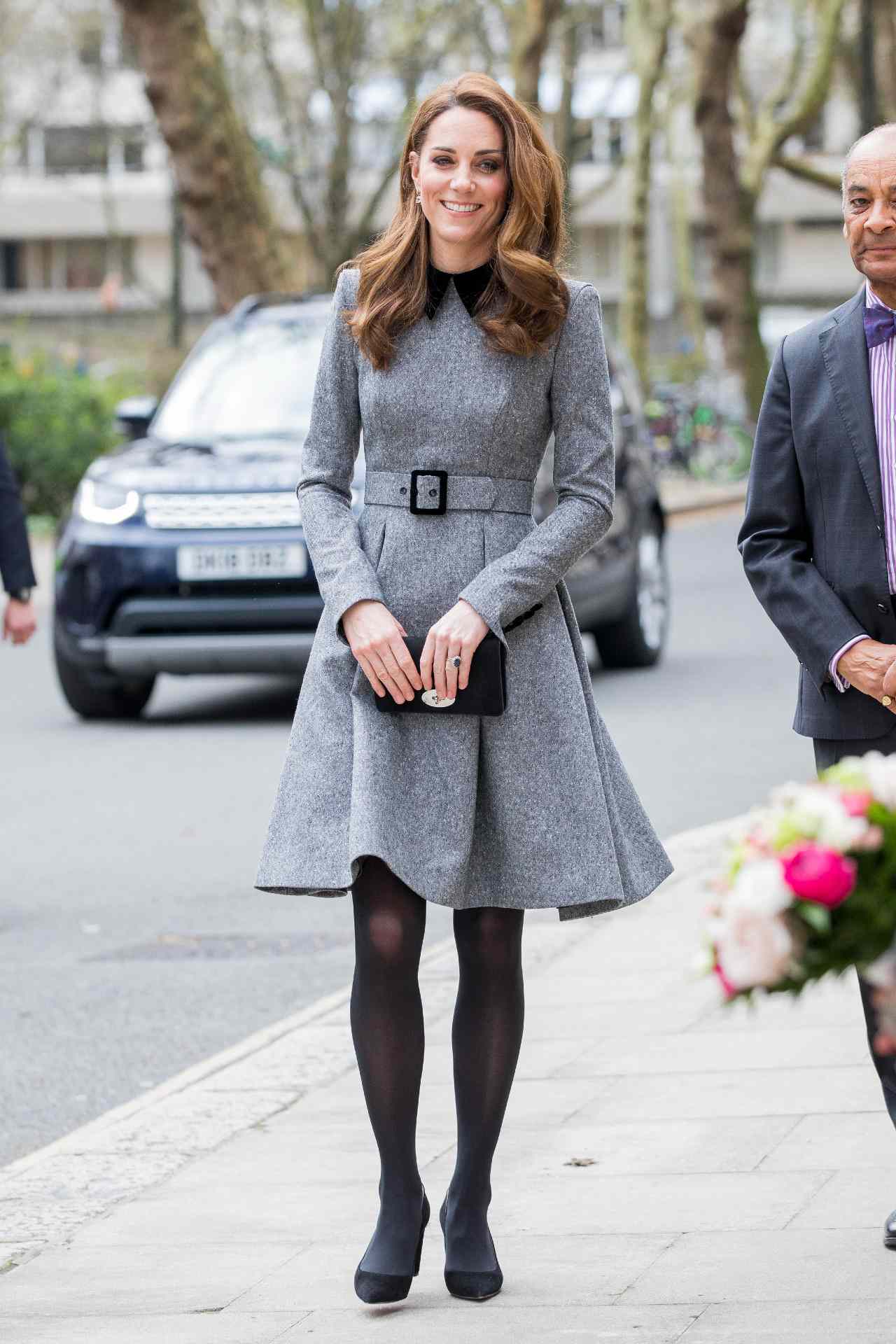 Kate Middleton in a belted, collared gray wool dress