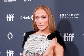 Jennifer Lopez Straight Face Posing in Silver Mirror Gown With Cutouts and Black Bows at Premiere of 'Unstoppable' at 2024 Toronto Film Festival 