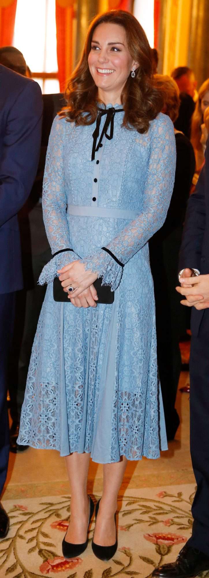 Kate Middleton in a baby blue lace Temperley London dress with black buttons