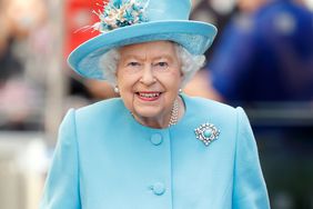 Queen Elizabeth Smiling Blue Dress Coat Matching Hat Clasping Gloved Hands Carrying Bag British Airways Headquarters 2019