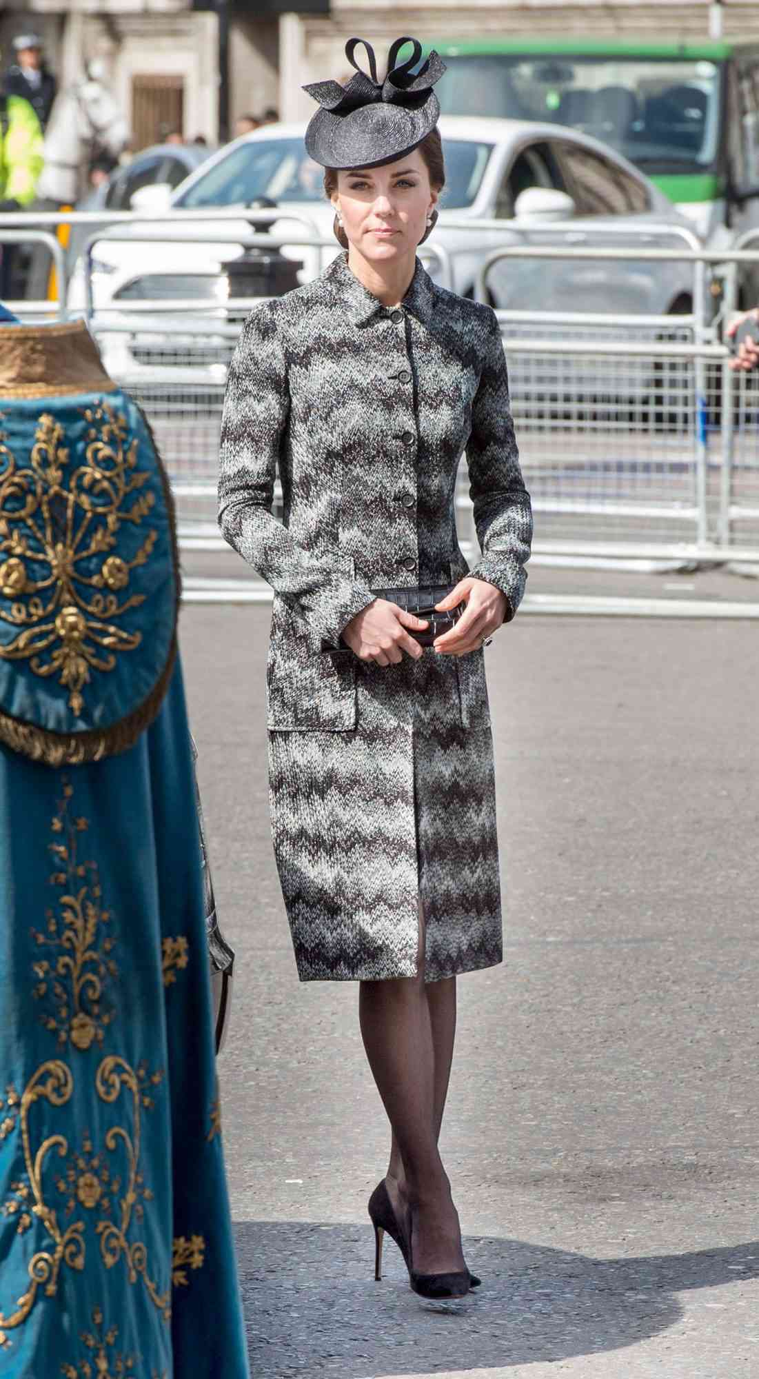 Kate Middleton in a black and gray patterned coat dress