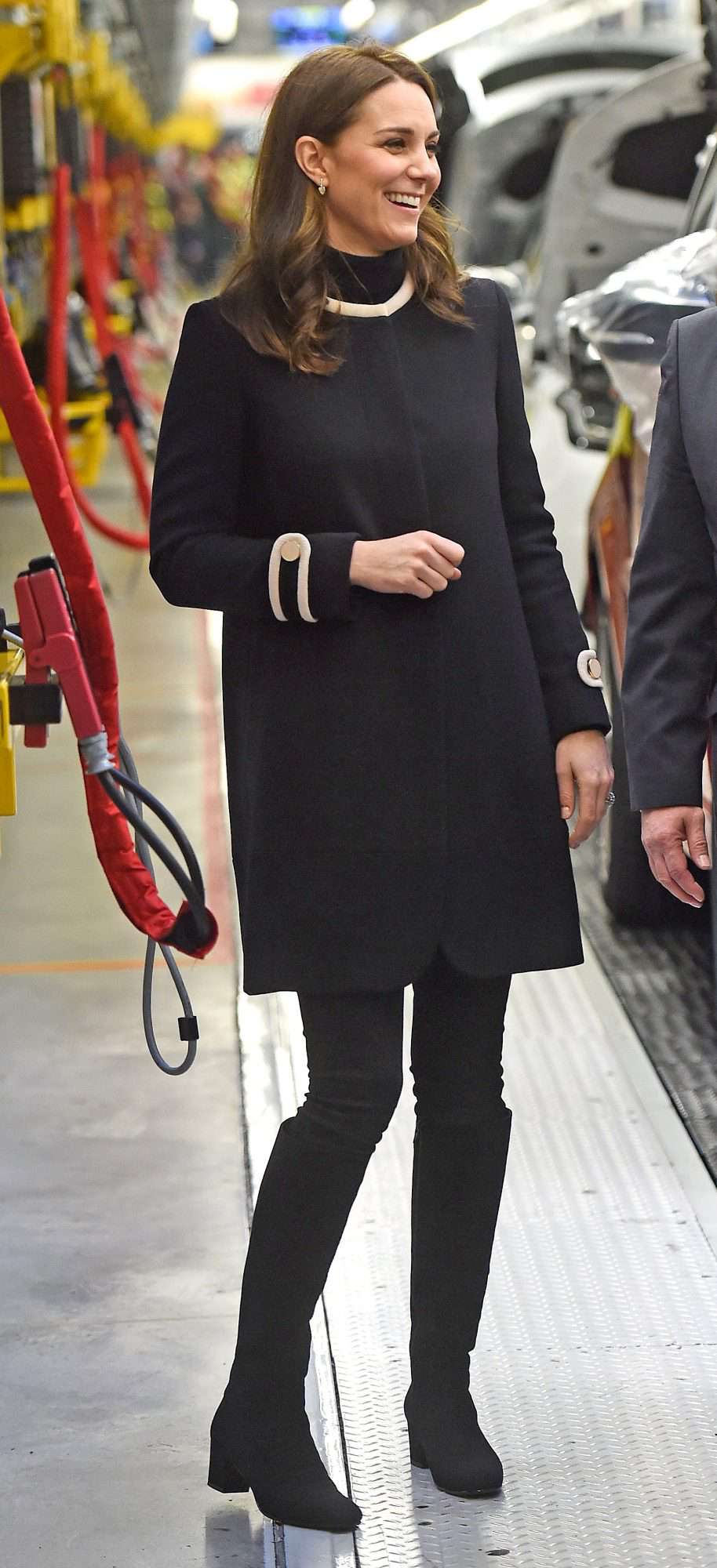 Kate Middleton in a nautical-inspired black coat paired with black skinny jeans and boots