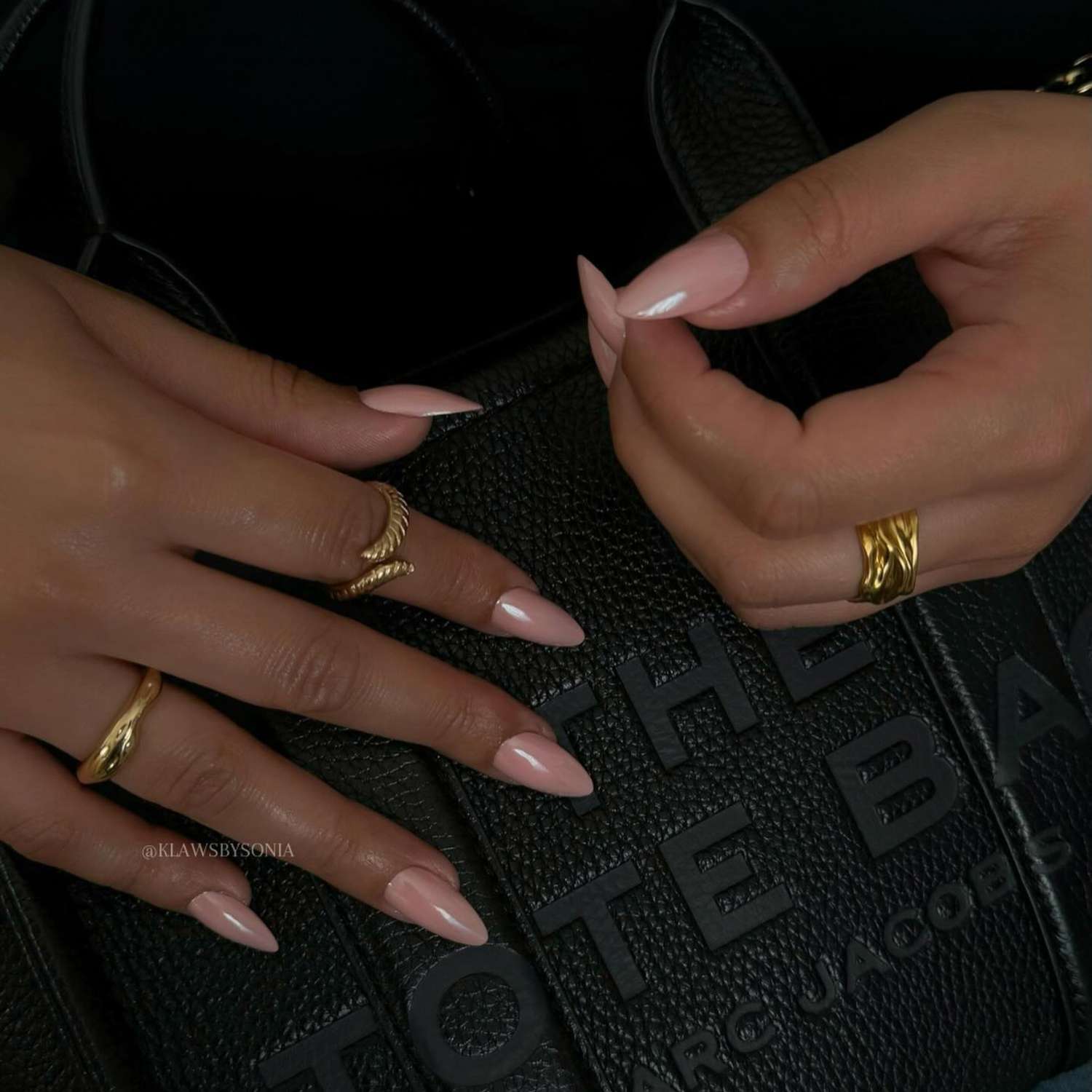 close up of nails with light pink chrome manicure