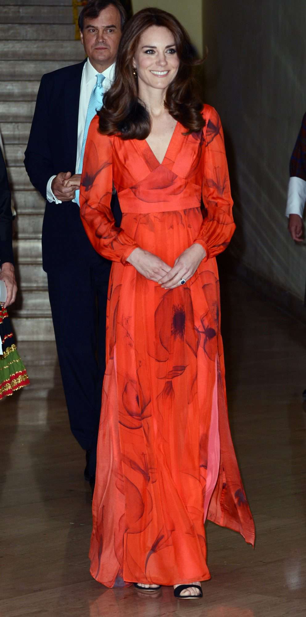 Kate Middleton in a fiery red Beulah London gown