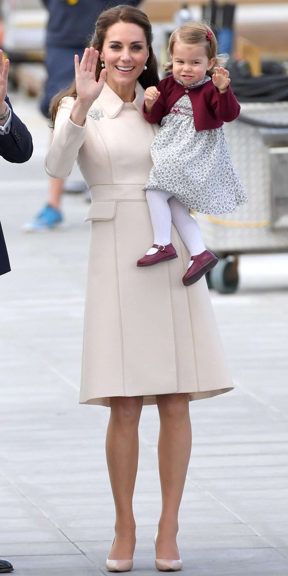 Kate Middleton in an ivory coat and nude pumps with Charlotte