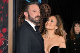 Jennifer Lopez looking up at Ben Affleck and smiling