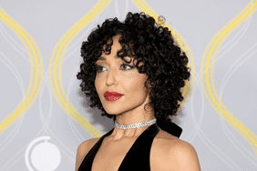 Ruth Negga with a curly bob.