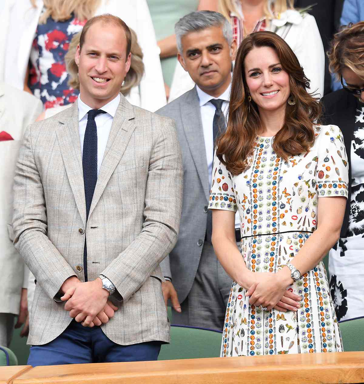 Kate Middleton in a whimsical Alexander McQueen dress alongside Prince William