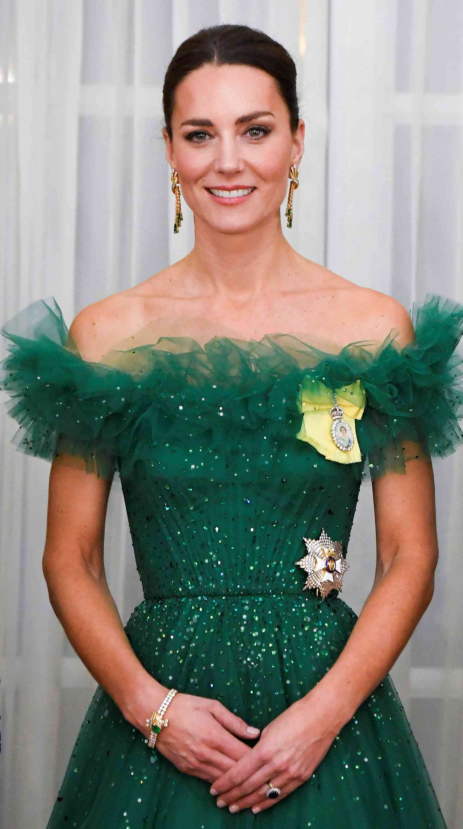 Kate Middleton in an emerald green sparkly off-the-shoulder gown