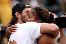 Gabby Thomas hugs her boyfriend Spencer McManes