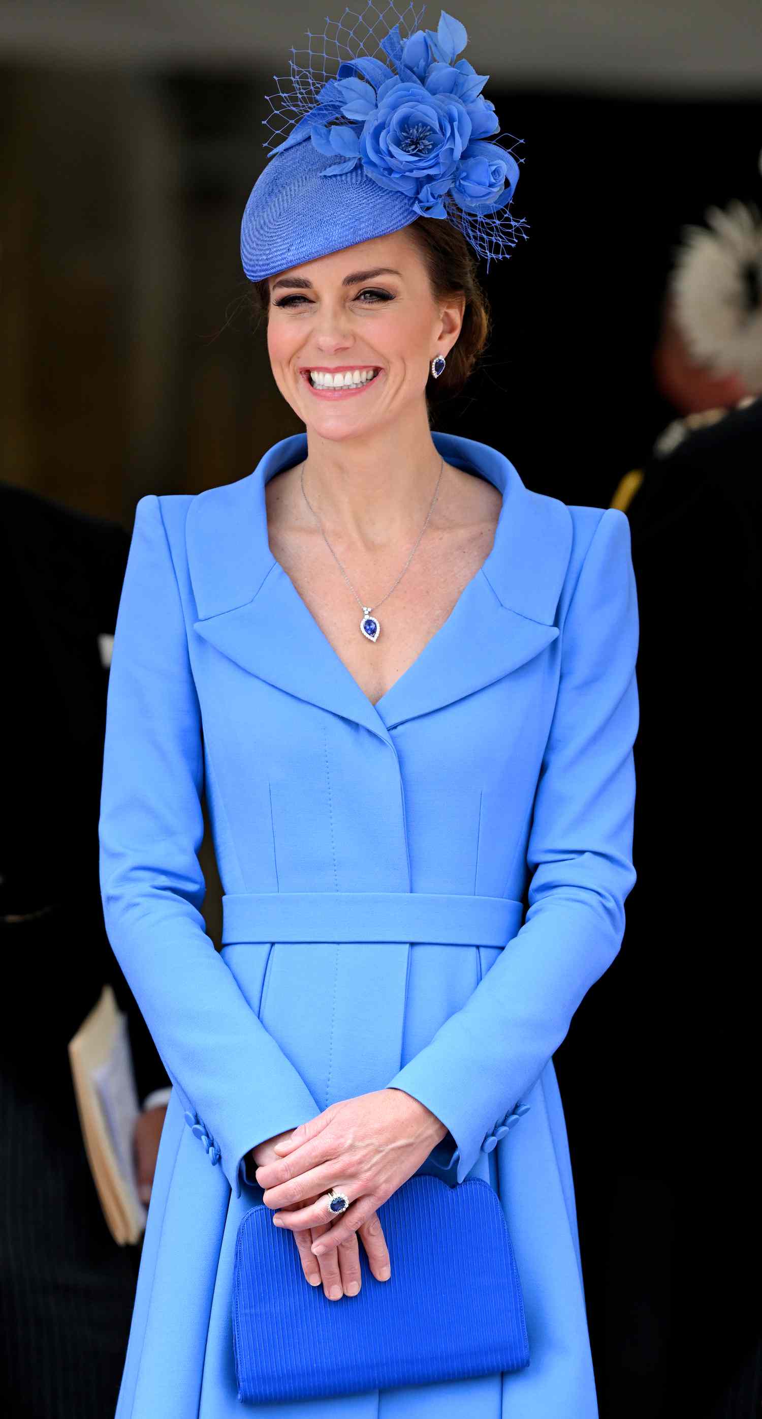 Kate Middleton in a blue skirt suit and hat