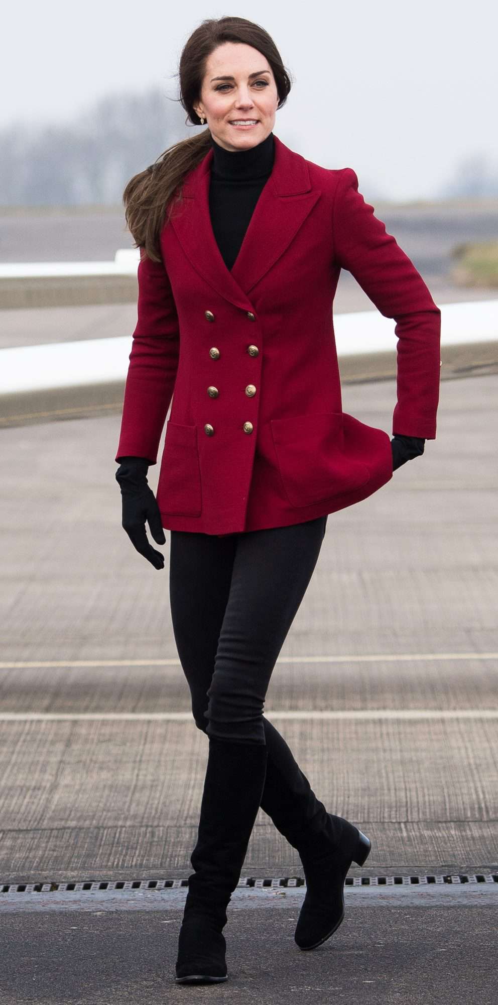 Kate Middleton in a double-breasted red wool blazer, black turtleneck, skinnies, and boots