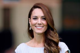 Kate Middleton Smiling Hair Curled on the Side Lilac Dress