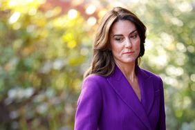 Kate Middleton Looking Down Purple suit