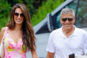 Amal Clooney in a pink dress and George Clooney in a white shirt Walking