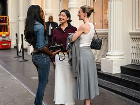 Three women talking on the street at new york fashion week