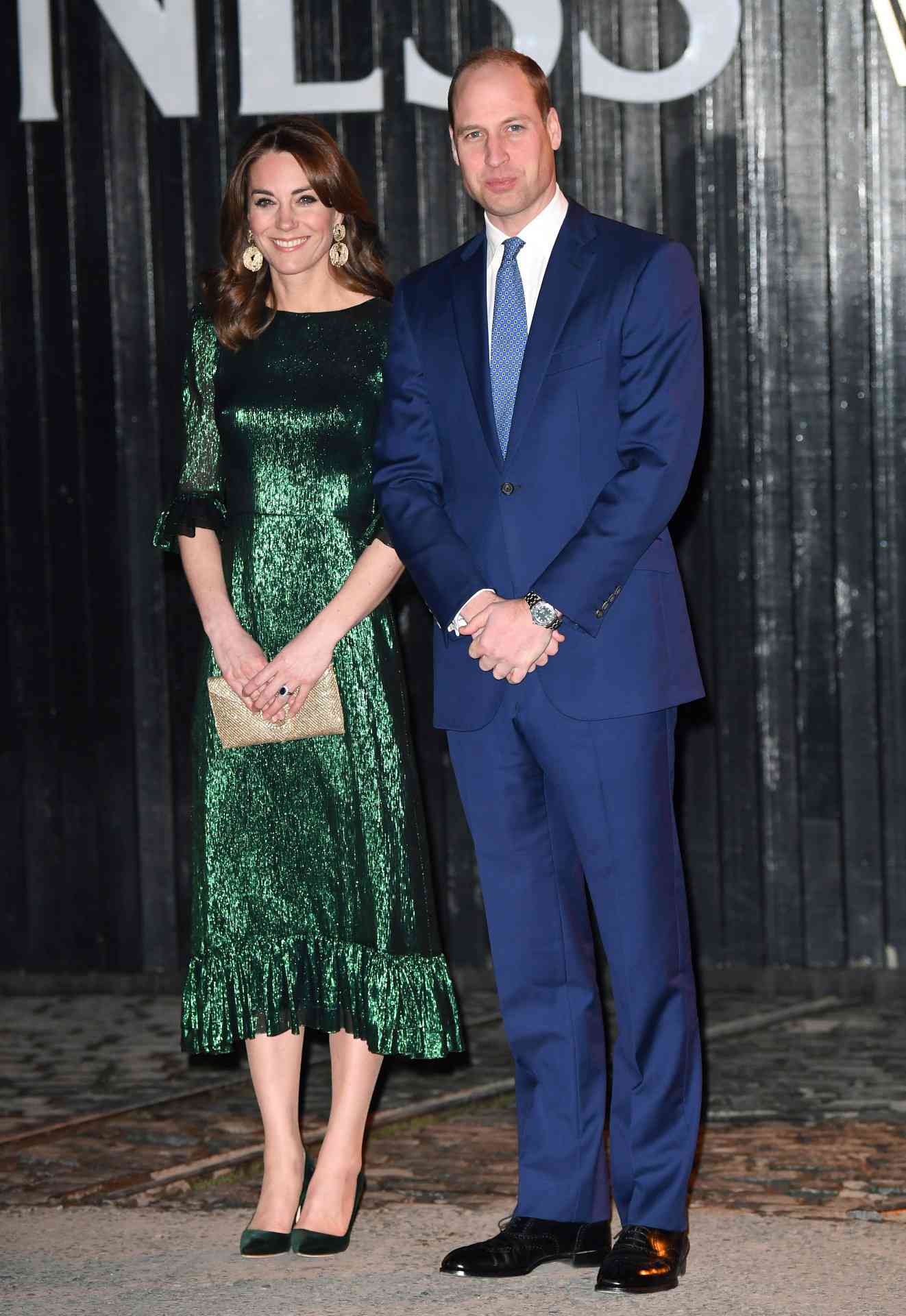 Kate Middleton in a sparkly emerald green dress alongside Prince William