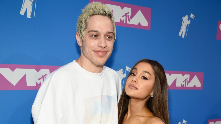 Pete Davidson wearing a white shirt with Ariana Grande