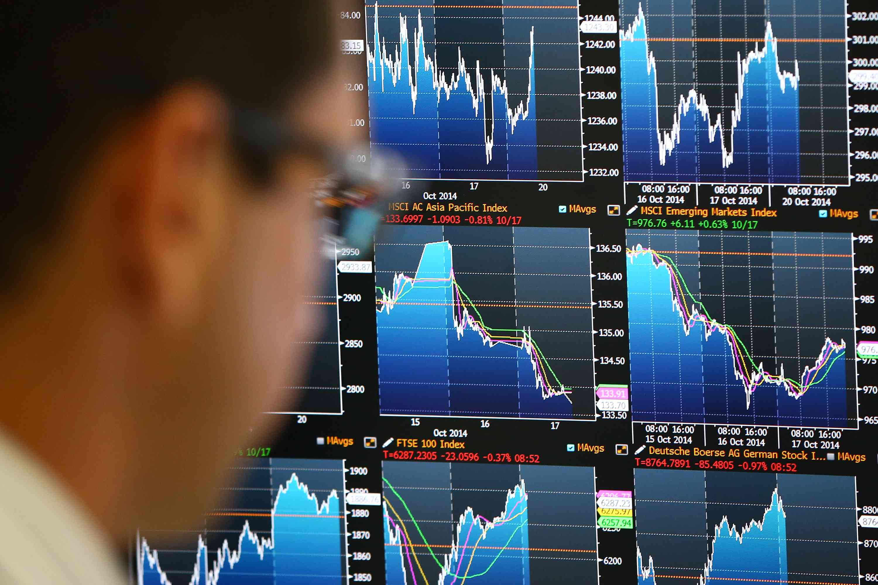 Trader monitoring stock screen