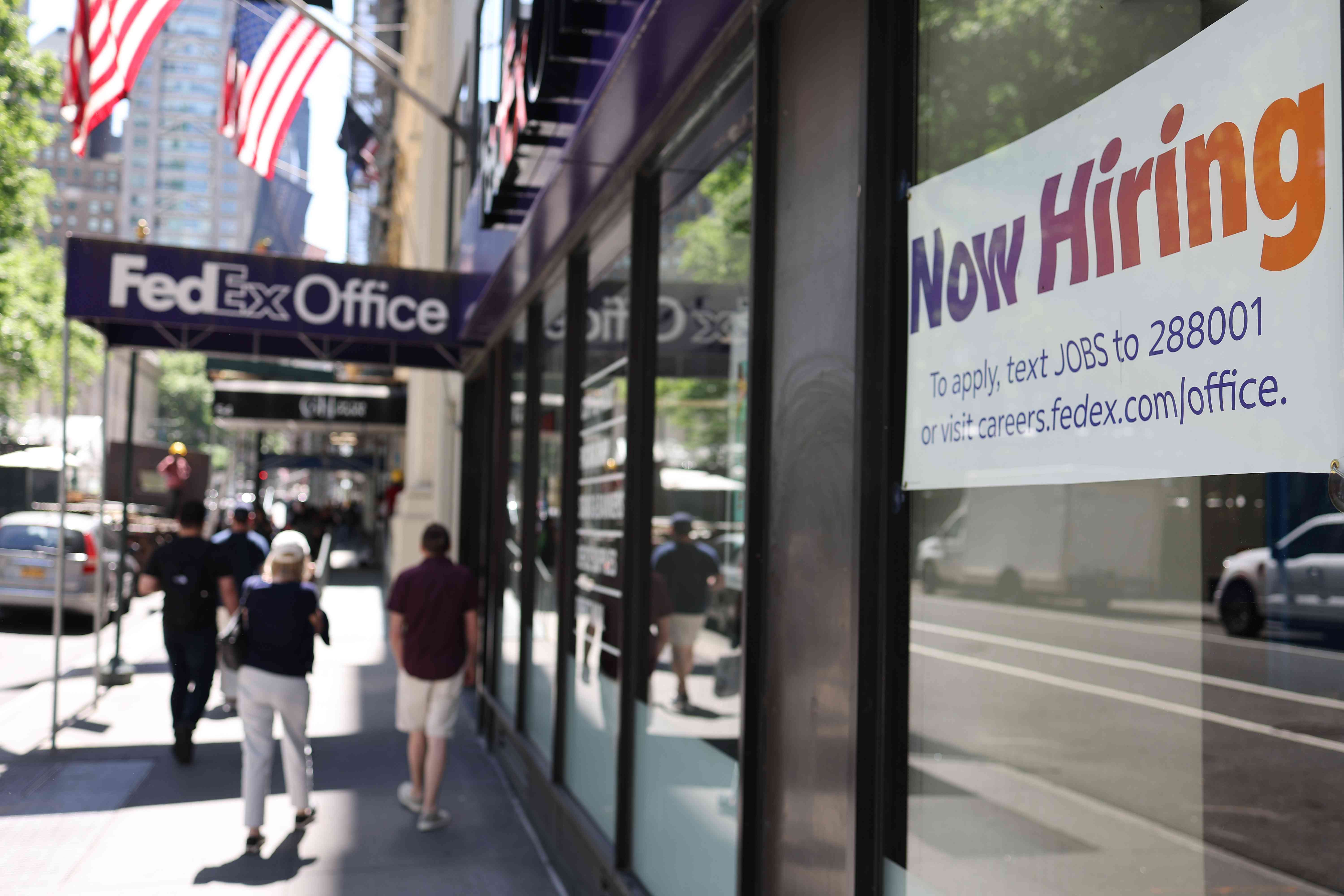 "Now Hiring" sign at a FedEx in New York City on June 7, 2024. 