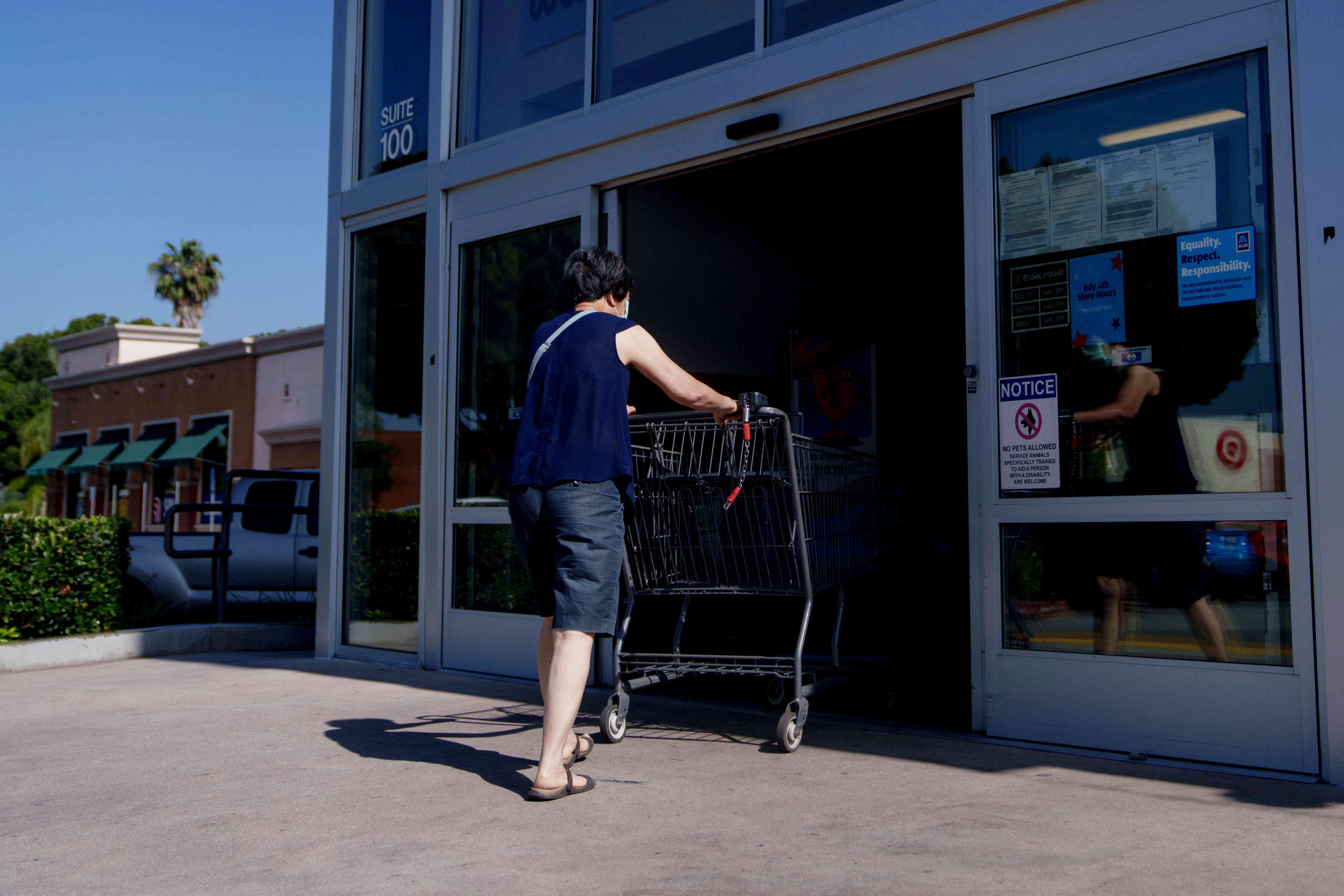 A shopper enters an Aldi supermarket in Alhambra, Calif., in June. 