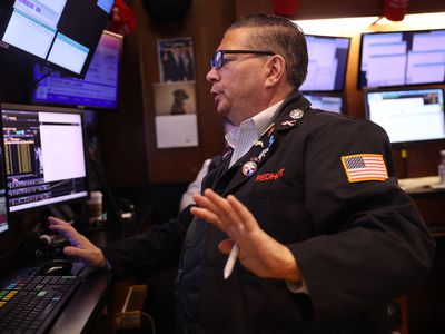 Traders work on the floor of the New York Stock Exchange during morning trading on August 20, 2024 in New York City. 