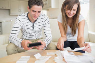 A young couple working on their taxes.