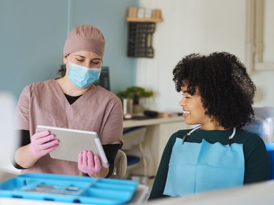 Female dentist during a consultation with her patient